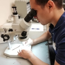 Gould Fasteners Employee Inspecting Part